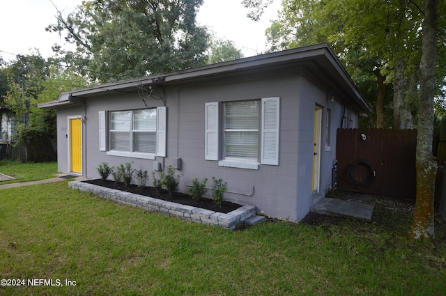 view of home's exterior with a yard