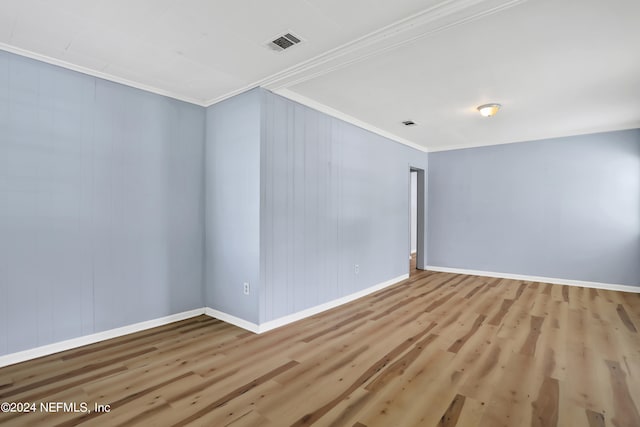 interior space with hardwood / wood-style flooring and crown molding