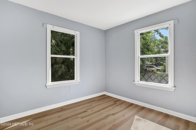 spare room featuring hardwood / wood-style flooring