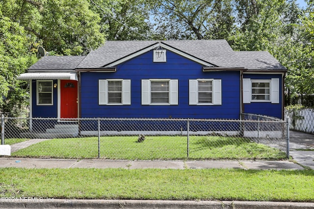 view of front of home with a front lawn