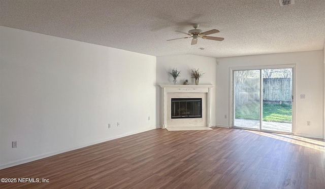 unfurnished living room featuring hardwood / wood-style floors, a textured ceiling, and ceiling fan