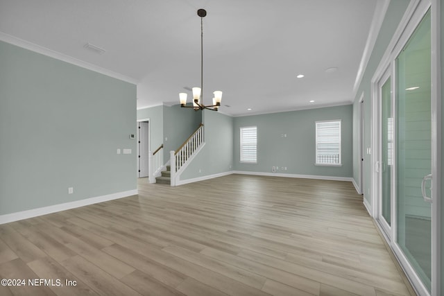 interior space with stairs, ornamental molding, light wood-type flooring, and baseboards