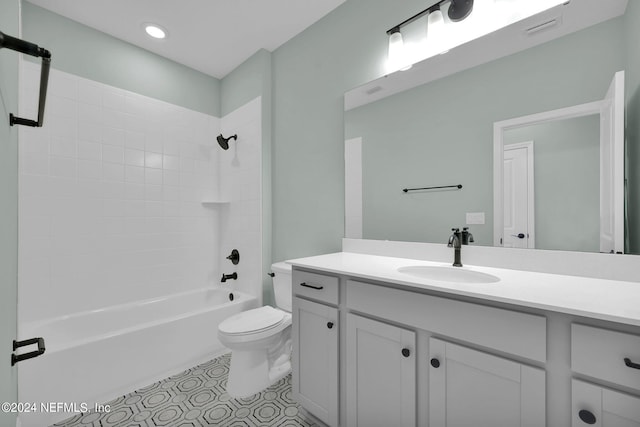 bathroom featuring toilet, visible vents, vanity, shower / bathing tub combination, and tile patterned floors