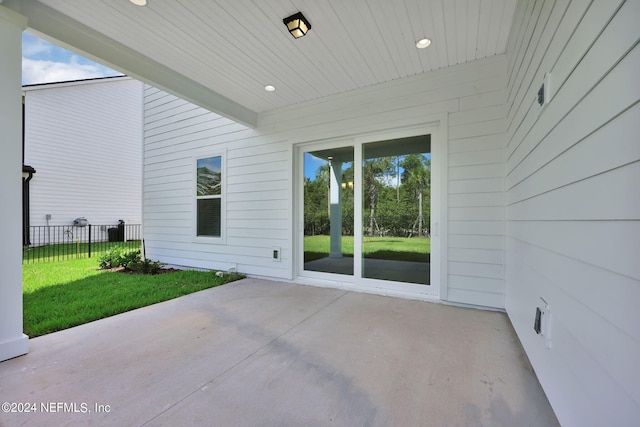 view of patio featuring fence