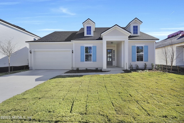 view of front facade featuring a garage and a front lawn