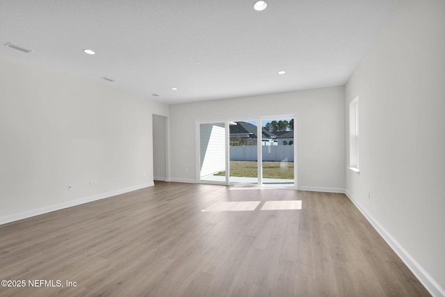 unfurnished room featuring light wood-type flooring