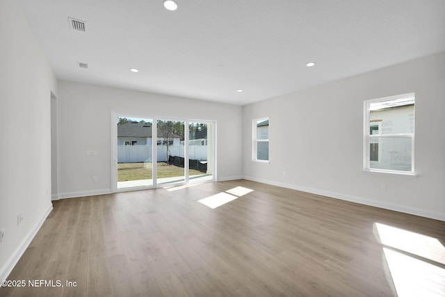 spare room featuring light wood-type flooring