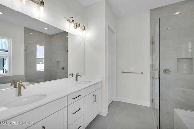 bathroom featuring walk in shower and vanity