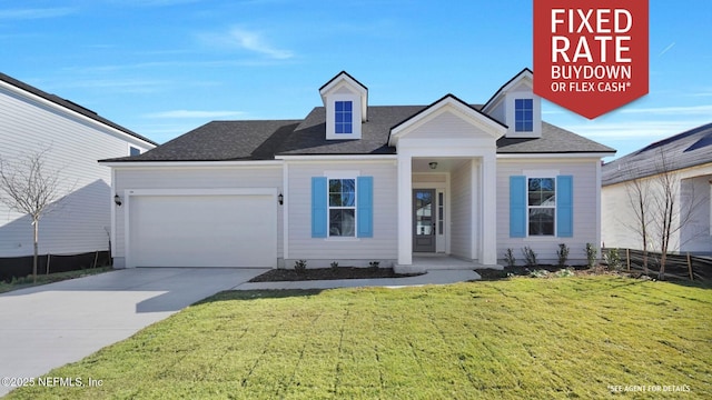 view of front of home with a garage and a front yard