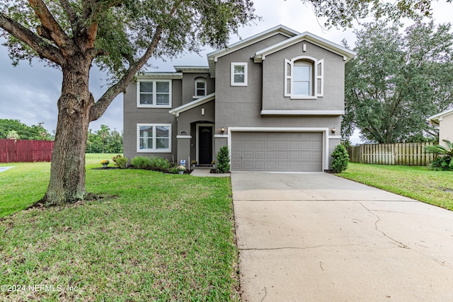 front of property featuring a garage and a front lawn