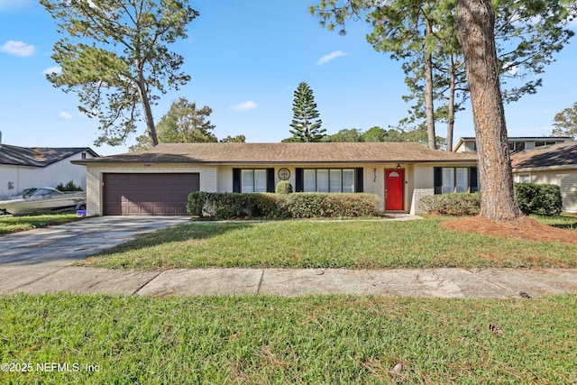 ranch-style house with a garage and a front yard