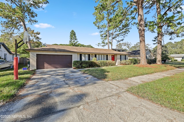 single story home with a front yard and a garage