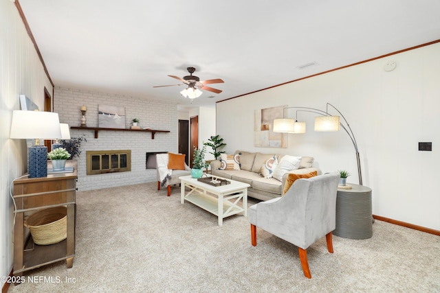 living room with light colored carpet, a brick fireplace, ceiling fan, and ornamental molding