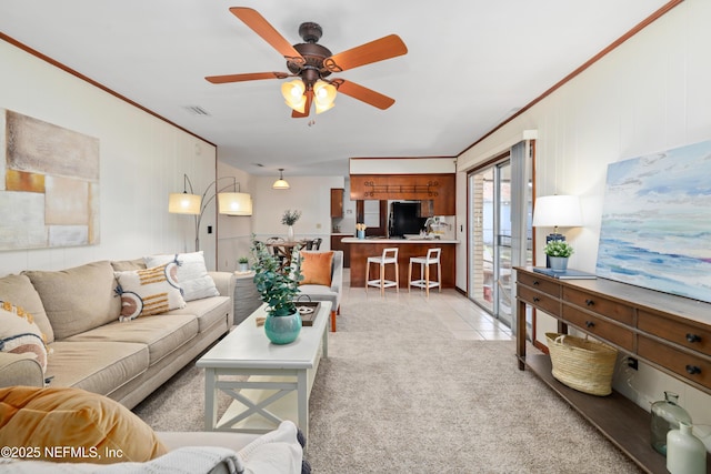 living room with ceiling fan and light tile patterned floors