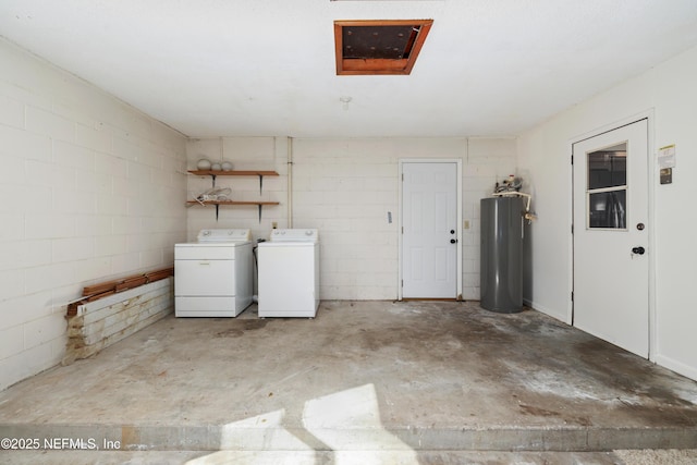 laundry area featuring washing machine and dryer and water heater