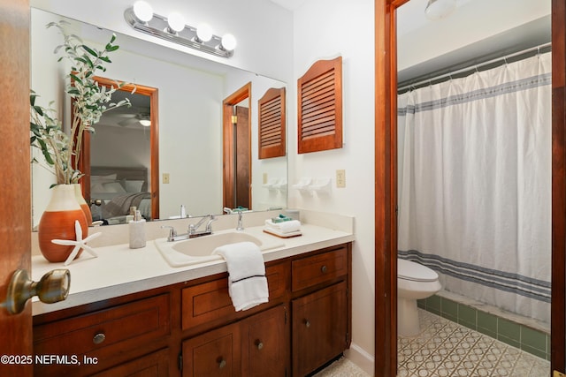 bathroom with tile patterned floors, vanity, and toilet