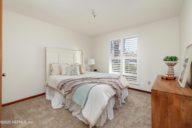 bedroom with light colored carpet