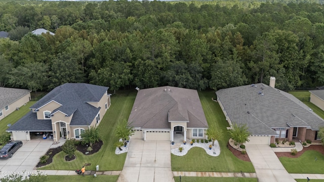 aerial view featuring a wooded view