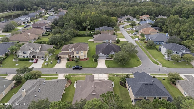 birds eye view of property with a residential view