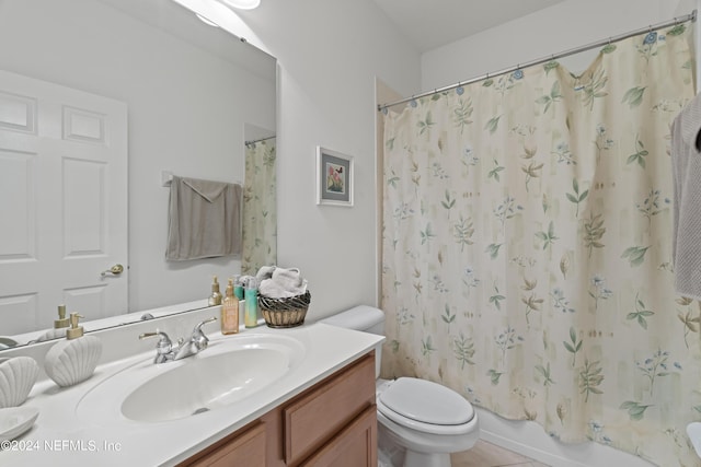 full bathroom featuring shower / bath combination with curtain, vanity, and toilet