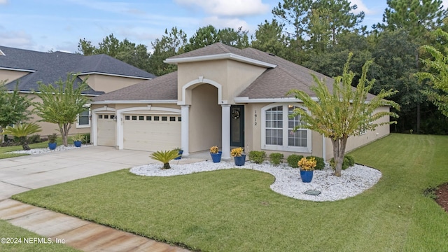 ranch-style house featuring a front yard, concrete driveway, an attached garage, and stucco siding