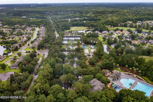 bird's eye view featuring a water view and a residential view