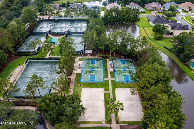 birds eye view of property featuring a water view and a residential view