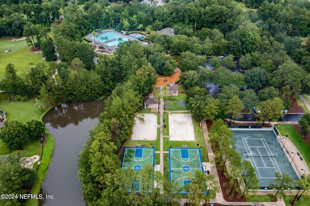 birds eye view of property with a water view