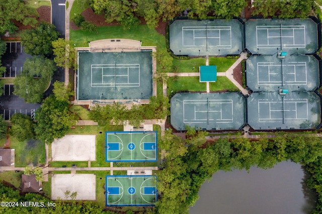 birds eye view of property with a water view