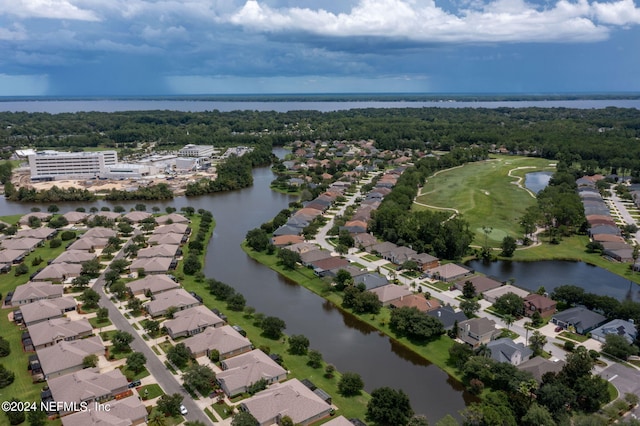 bird's eye view featuring a residential view and a water view