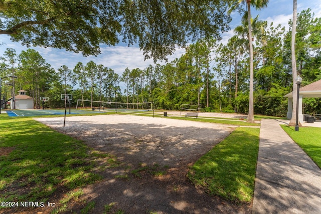 surrounding community featuring volleyball court, a lawn, and community basketball court