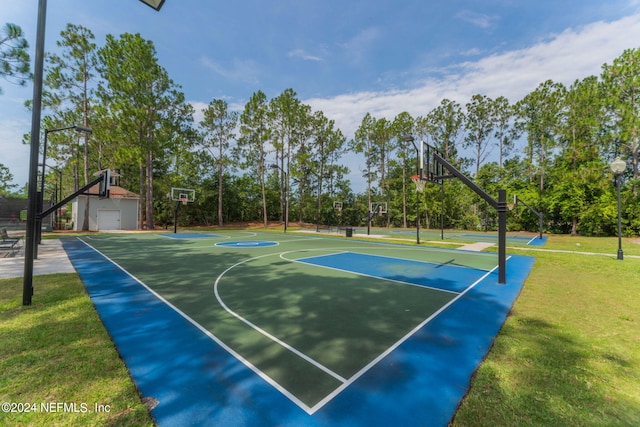 view of basketball court featuring community basketball court and a yard