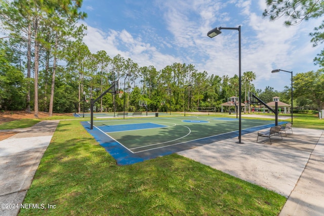 view of sport court featuring community basketball court and a lawn