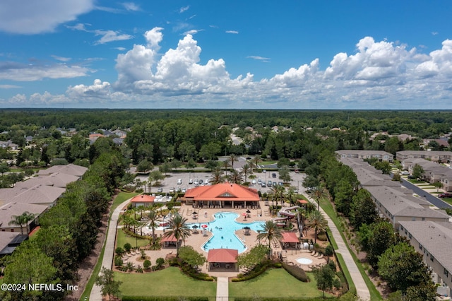 birds eye view of property featuring a residential view and a view of trees