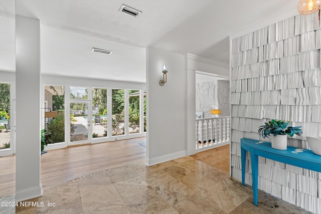 interior space featuring baseboards and visible vents