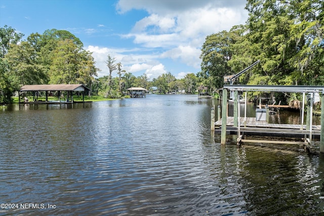 view of dock with a water view and boat lift