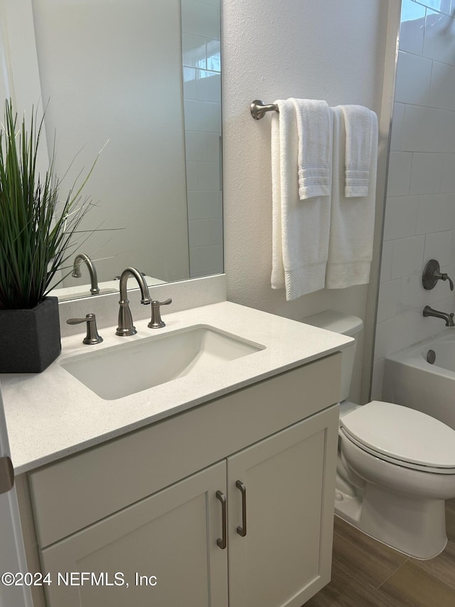 95246 Golden Glow Dr, Fernandina Beach, FL 32034 - bathroom featuring vanity, wood finished floors, and tub / shower combination