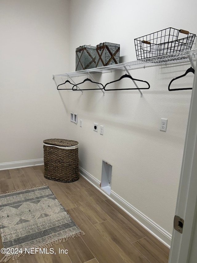 laundry area with washer hookup, hookup for an electric dryer, and wood-type flooring