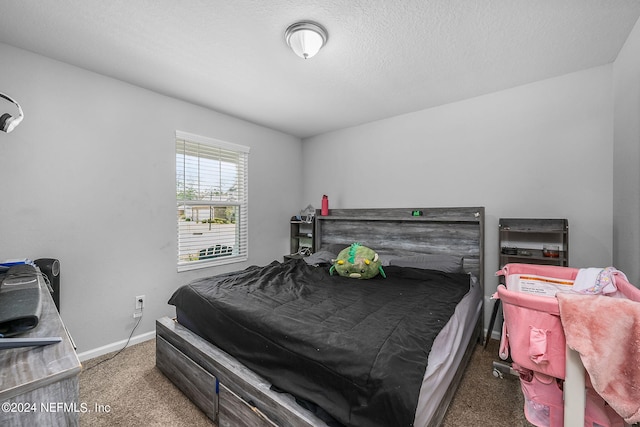 carpeted bedroom with a textured ceiling