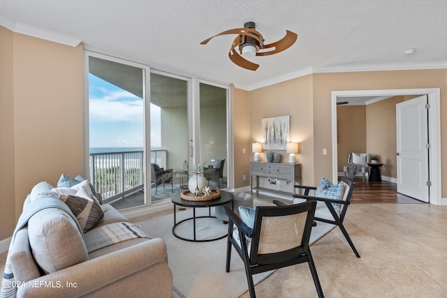 living area featuring baseboards, expansive windows, ornamental molding, and ceiling fan