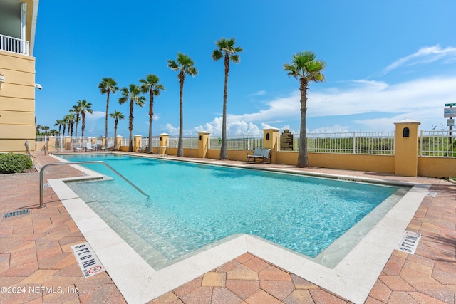 view of swimming pool featuring a patio area