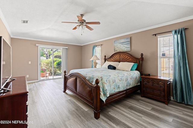 bedroom featuring ceiling fan, hardwood / wood-style flooring, access to exterior, and crown molding