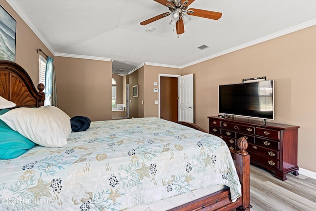 bedroom with ceiling fan, light hardwood / wood-style floors, and ornamental molding