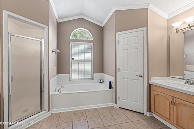 bathroom featuring tile patterned flooring, separate shower and tub, lofted ceiling, crown molding, and vanity