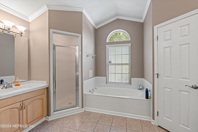 bathroom featuring vaulted ceiling, vanity, crown molding, tile patterned flooring, and shower with separate bathtub