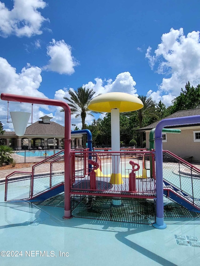 community play area featuring fence