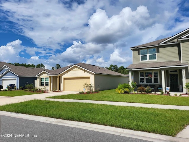 view of front of property featuring a garage and a front lawn