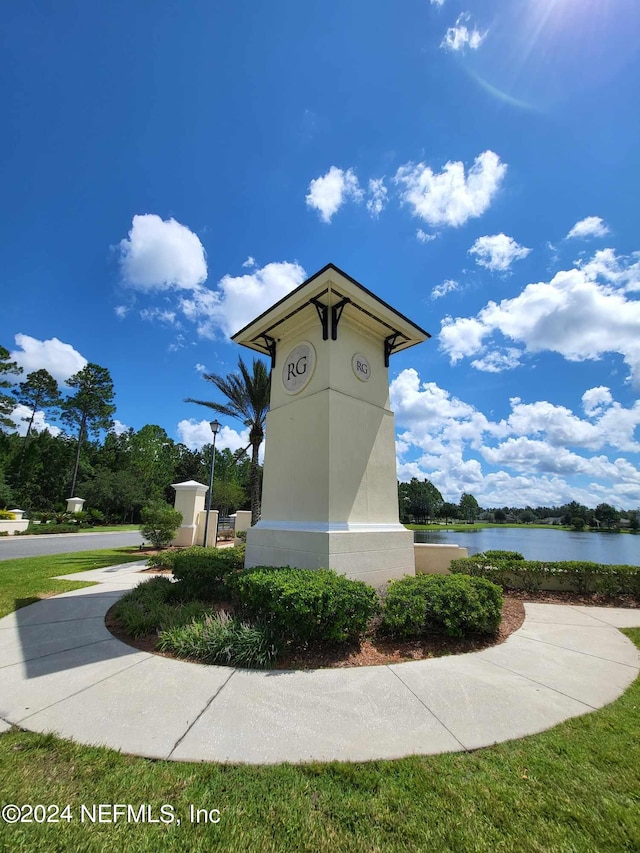 surrounding community featuring a water view