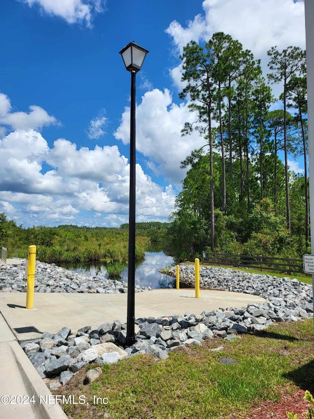 surrounding community featuring a water view