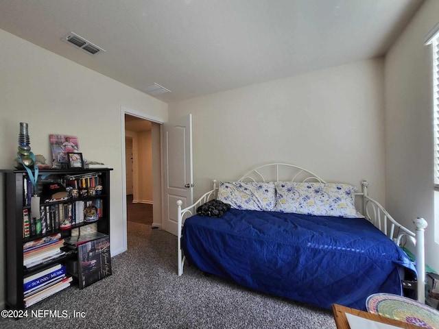 bedroom with dark carpet